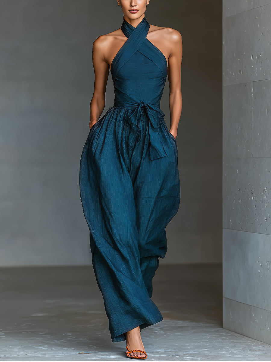 Selene | Tuta blu navy con scollo halter incrociato e gamba ampia
