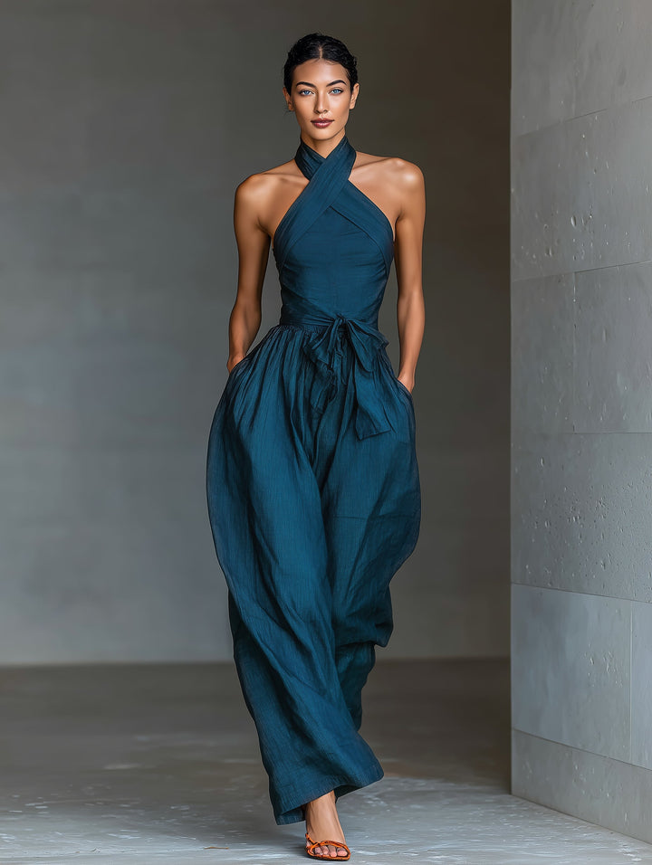 Selene | Tuta blu navy con scollo halter incrociato e gamba ampia