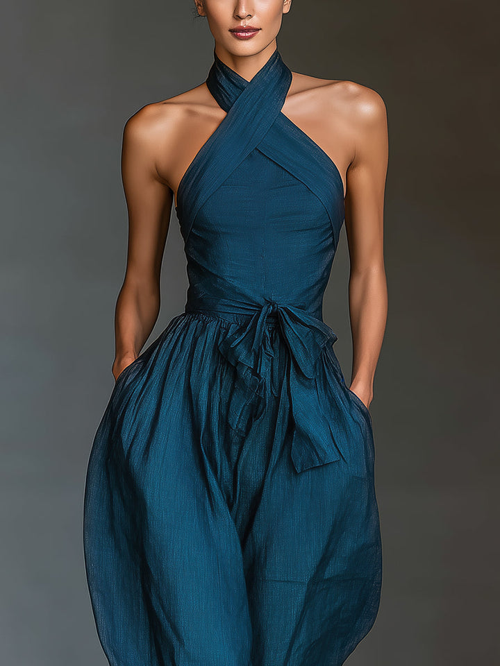 Selene | Tuta blu navy con scollo halter incrociato e gamba ampia