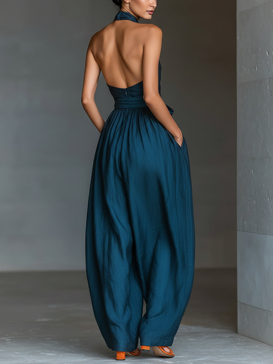 Selene | Tuta blu navy con scollo halter incrociato e gamba ampia