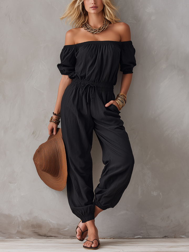 Basilicata | Tuta nera off-shoulder dalla linea morbida