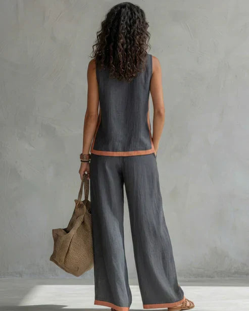 Nicole | Completo due pezzi top senza maniche e pantaloni a gamba larga con profili cuoio