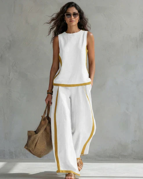 Nicole | Completo due pezzi top senza maniche e pantaloni a gamba larga con profili cuoio