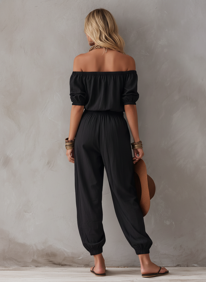 Basilicata | Tuta nera off-shoulder dalla linea morbida