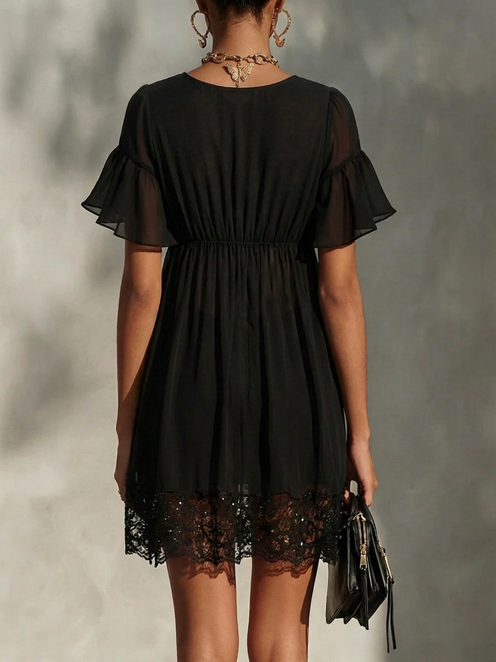 Modena | Miniabito nero in chiffon con cremallera dorata e orlo in pizzo