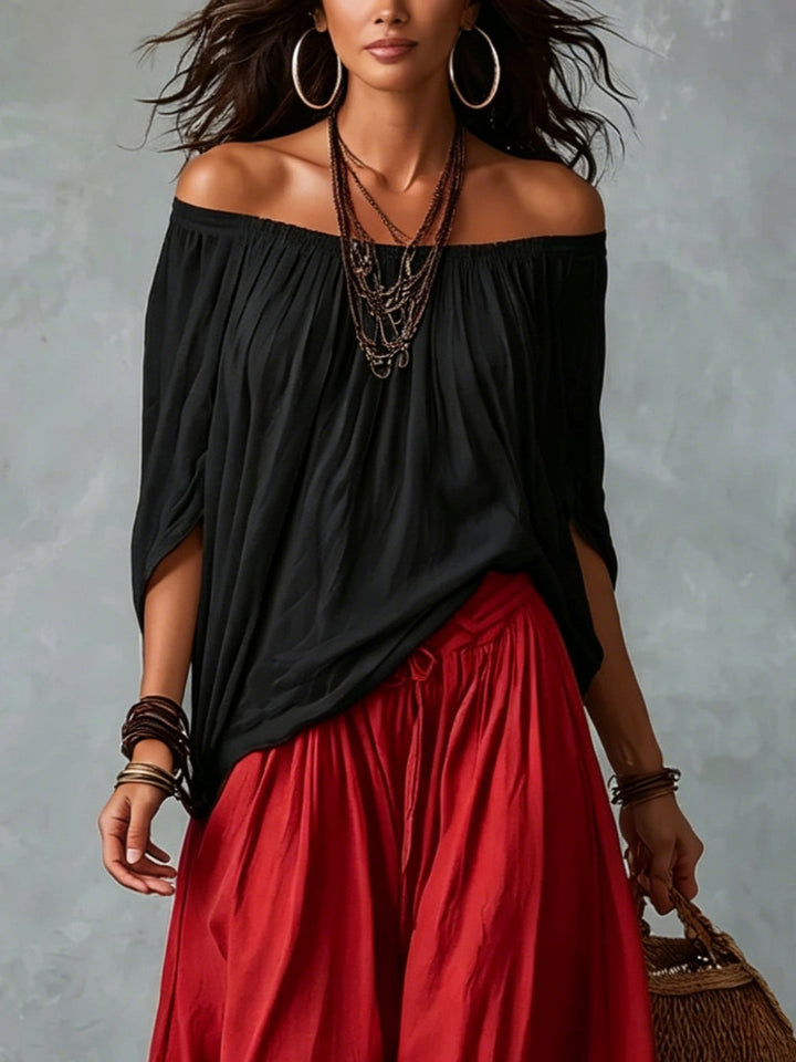 Lipari | Completo due pezzi con top nero off-shoulder e pantaloni lanterna rossi
