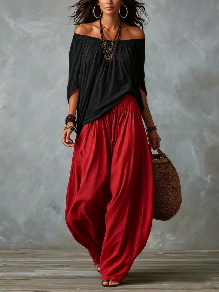 Lipari | Completo due pezzi con top nero off-shoulder e pantaloni lanterna rossi