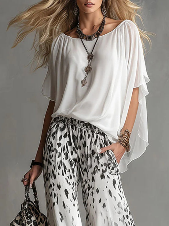 Anna | Completo con top a mantella e pantaloni leopardati a gamba larga