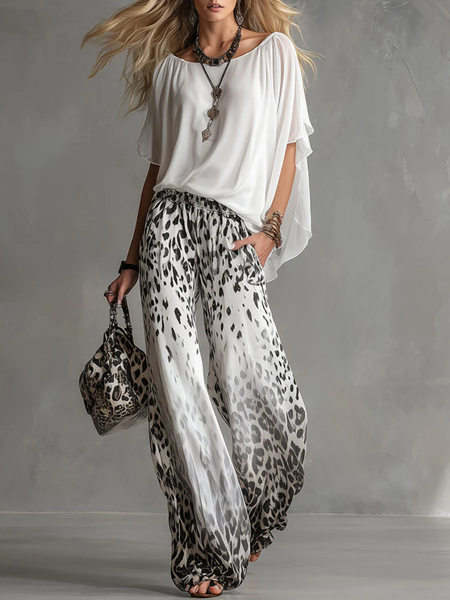 Anna | Completo con top a mantella e pantaloni leopardati a gamba larga