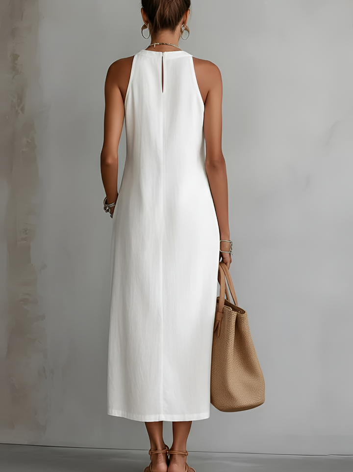 Splendida | Abito midi smanicato bianco con dettagli ricamati e tasche laterali